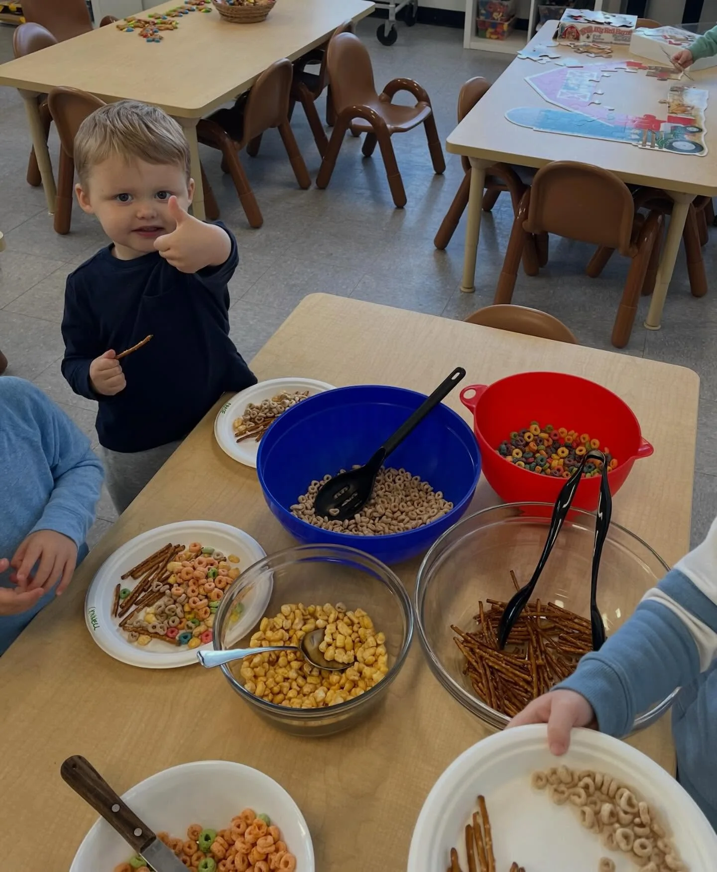 UMC Preschool children preparing a classroom snack activity